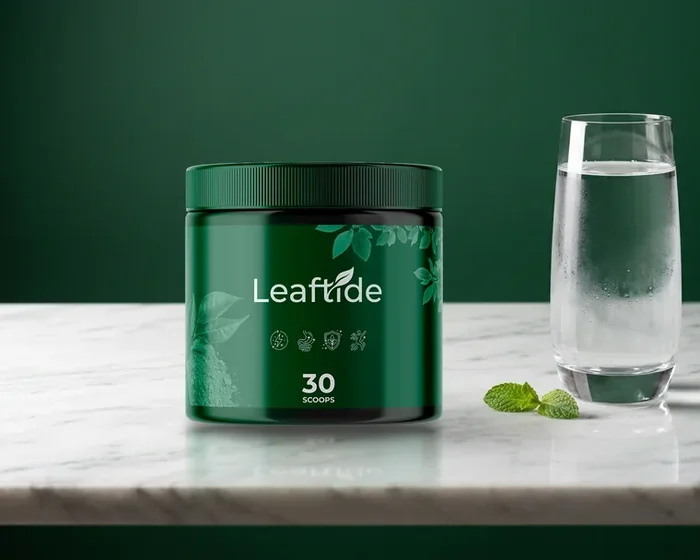 Green Leaftide tub marked 30 scoops on a marble counter beside a glass of water, as pictured by the seller